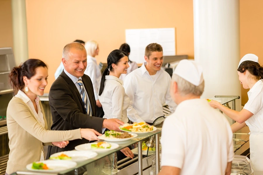 office colleagues picking up food in canteen